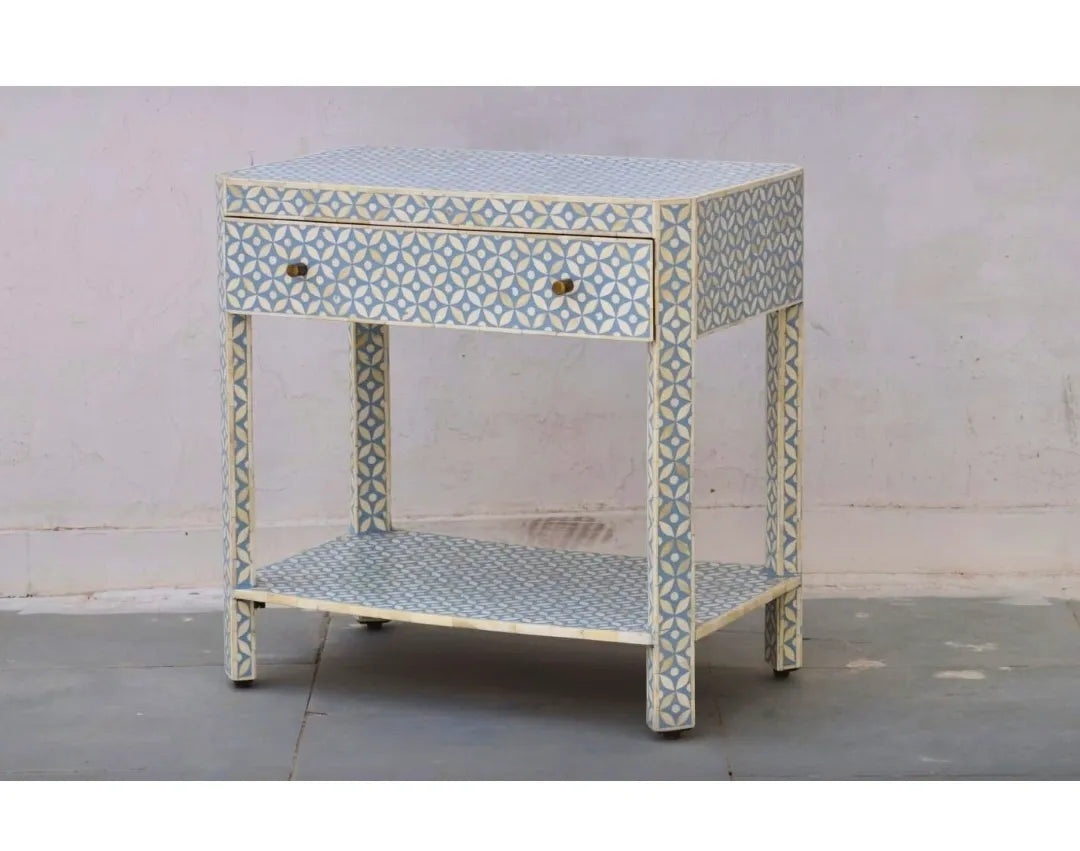 Decorative side table with geometric pattern on a plain background