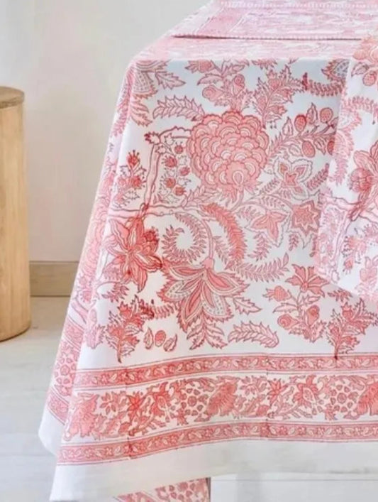 Tablecloth with floral pattern on a table with drinks and fruits