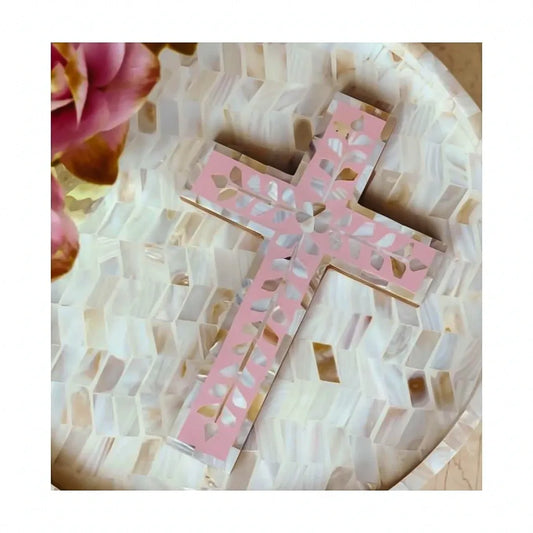 Pink cross on a mosaic background with flowers